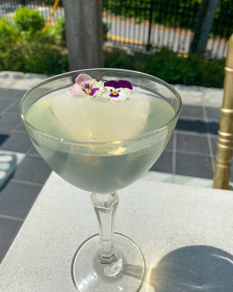 The aromatics of honeysuckle and chamomile blend in Falling Rabbit's Blossoming Revival cocktail, garnished with edible violets. Courtesy of Barbara Woods