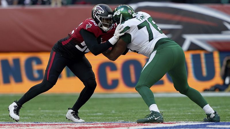 Falcons linebacker Adetokunbo Ogundeji (92) locks up with New York Jets offensive tackle George Fant (76) Sunday, Oct. 10, 2021, at Tottenham Hotspur Stadium in London. The  Falcons won 27-20. (Steve Luciano/AP)