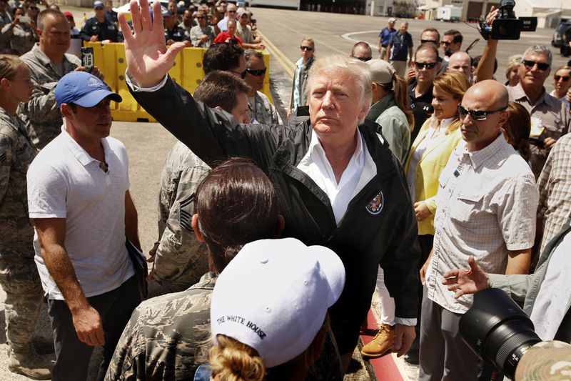 President Donald Trump and first lady Melania arrive at Muniz Air National Guard Base in Carolina, Puerto Rico on Oct. 3, 2017, almost two weeks after Hurricane Maria hit the island. (Carolyn Cole/Los Angeles Times/TNS)