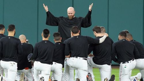 Astros catcher Brian McCann gives the eulogy for Carlos Beltran's glove in center field at Minute Maid Park on July 17, 2017 in Houston, Texas. Beltran has not played outfield since May 16.