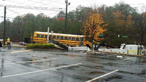 Gwinnett County Public Schools spokeswoman Sloan Roach said the bus "went off the road" at the intersection of Peachtree Industrial Boulevard and North Berkeley Lake Road.