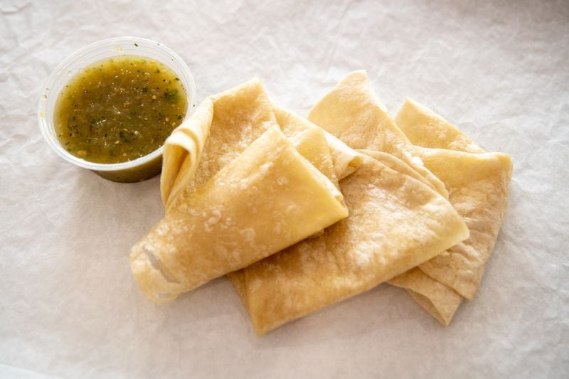 Poco Loco house-made flour tortillas and salsa verde. (Mia Yakel for The Atlanta Journal-Constitution)