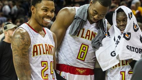 Atlanta Hawks’ Kent Bazemore (24), Dwight Howard (8), and Dennis Schroder, right, fool around after defeating the Cleveland Cavaliers in an NBA basketball game in Cleveland, Tuesday, Nov. 8, 2016. (AP Photo/Phil Long)