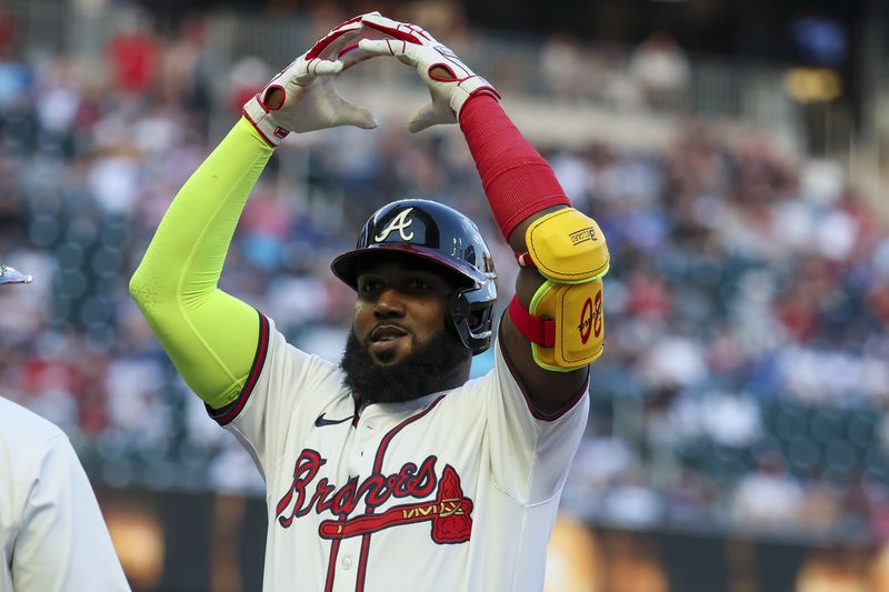 Atlanta Braves designated hitter Marcell Ozuna celebrates after hitting a RBI single during the first inning against the Miami Marlins at Truist Park, Wednesday, April 24, 2024, in Atlanta. (Jason Getz / AJC)

