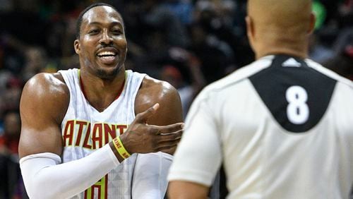 Atlanta Hawks center Dwight Howard argues with referee Marc Davis (8) about a foul called on him during the second half of an NBA basketball game against the Portland Trail Blazers, Saturday, March 18, 2017, in Atlanta. Portland won 113-97. (AP Photo/John Amis)