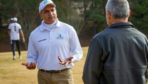 President of the Johns Creek Cricket Association Shafiq Jadvji talks with people on the sidelines before the start of the match between Lambert High School and Northview High School at Shakerag Park in Johns Creek Sunday, November 6, 2020.   STEVE SCHAEFER FOR THE ATLANTA JOURNAL-CONSTITUTION