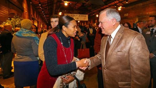 Linda Pritchett is in next week&amp;rsquo;s runoff election to replace former Sen. Vincent Fort. She&#039;s seen here shaking Gov. Nathan Deal&#039;s hand at the Wild Hog Supper on Jan. 12, 2014.