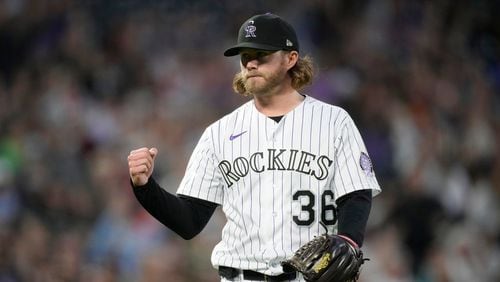 Colorado Rockies relief pitcher Pierce Johnson gestures after getting Detroit Tigers' Eric Haase to hit into a double play to end a baseball game Friday, June 30, 2023, in Denver. (AP Photo/David Zalubowski)