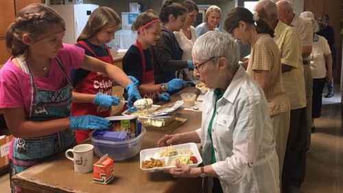 National Charity League volunteers serve lunch at the Alpharetta/Crabapple Senior Center. (Courtesy Senior Services North Fulton)