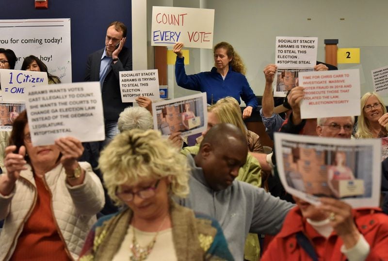 Groups on both sides of the voter access issue crowded into the Gwinnett County Board of Elections meeting on Tuesday afternoon. HYOSUB SHIN / HSHIN@AJC.COM