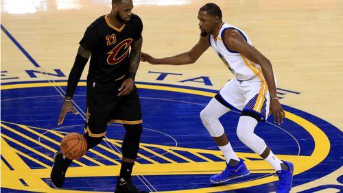 LeBron James of the Cleveland Cavaliers is defended by Kevin Durant  of the Golden State Warriors during the second half of Game 2 of the 2017 NBA Finals at ORACLE Arena on June 4, 2017 in Oakland, California. (Photo by Ronald Martinez/Getty Images)