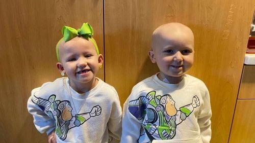 Sawyer Vines and Levi Lansdell, both age 3 in this photo taken in February, at Children's Healthcare of Atlanta Hospital. The two became best friends, and their parents also formed a close friendship, during their long hospital stay for cancer treatments. Both children are now out of the hospital and their cancer is in remission. Photo courtesy of CURE Childhood Cancer
