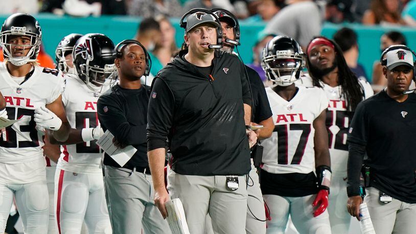 Atlanta Falcons head coach Arthur Smith looks at his team from the sidelines during the first half of a NFL preseason football game against the Miami Dolphins, Saturday, Aug. 21, 2021, in Miami Gardens, Fla. (AP Photo/Wilfredo Lee)