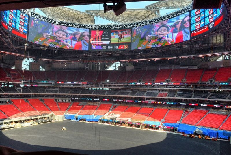 A view inside Mercedes-Benz Stadium reveals the massive video board below the roof opening. (Chris Hunt/Special)