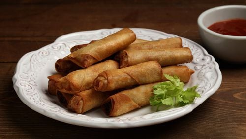 Growing up, Joseph Hernandez didn’t experience fast food, instead snacking on leftover lumpia shanghai, tightly rolled deep-fried cigarettes of finely chopped carrots, onion, celery leaves and pork. (Jason Wambsgans/Chicago Tribune/TNS)