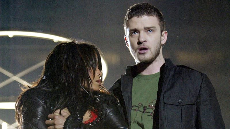Janet Jackson and surprise guest Justin Timberlake perform during the halftime show at Super Bowl XXXVIII between the New England Patriots and the Carolina Panthers at Reliant Stadium on February 1, 2004 in Houston, Texas.  At the end of the performance, Timberlake tore away a piece of Jackson's outfit.