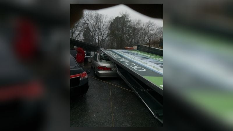In Rome, the storms were so severe that a billboard came down on one person’s car.