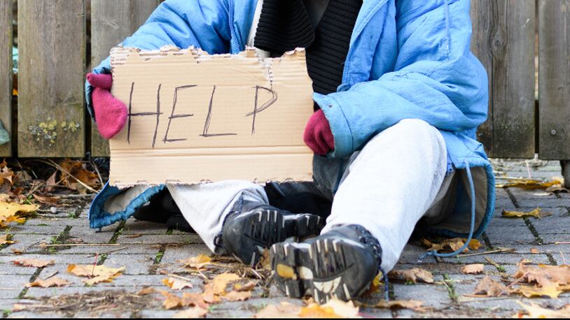 Homeless woman (stock photo).