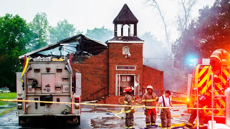 In this April 4, 2019 file photo, firefighters and fire investigators respond to a fire at Mt. Pleasant Baptist Church, in Opelousas, La. Authorities have arrested Holden Matthews, 21, in connection with suspicious fires at three historic black churches in southern Louisiana.