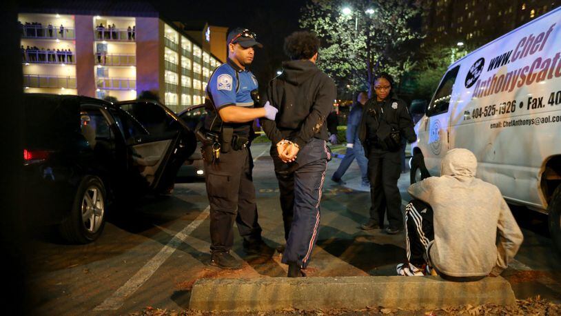 Georgia State University police detained two people following a double shooting outside of the Piedmont North residence hall March 21. Recent news reports of crimes on campues have students and parents concerned about safety. Ben Gray / bgray@ajc.com