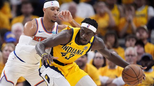 Indiana Pacers forward Pascal Siakam (43) drives around New York Knicks guard Josh Hart, left, during the first half of Game 6 in an NBA basketball second-round playoff series, Friday, May 17, 2024, in Indianapolis. (AP Photo/Michael Conroy)