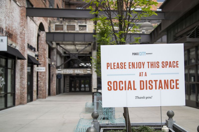 A sign encouraging social distancing is displayed at Ponce City Market in Atlanta’s Old Fourth Ward community on Monday, May 4, 2020. (ALYSSA POINTER / ALYSSA.POINTER@AJC.COM)