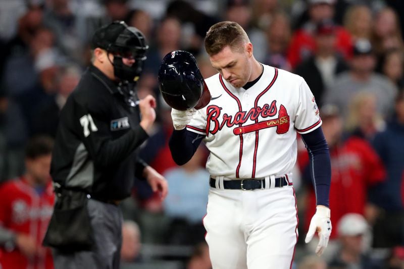 Braves first baseman Freddie Freeman reacts after striking out in the third inning of Game 2 of the NLCS Sunday, Oct. 17, 2021, against the Los Angeles Dodgers at Truist Park in Atlanta. (Curtis Compton / curtis.compton@ajc.com)