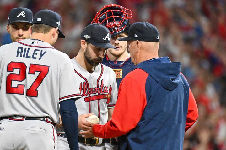 Atlanta Braves manager Brian Snitker (43) makes a pitching change for starting pitcher Spencer Strider, center, during the sixth inning of NLDS Game 4 at Citizens Bank Park in Philadelphia on Thursday, Oct. 12, 2023.   (Hyosub Shin / Hyosub.Shin@ajc.com)