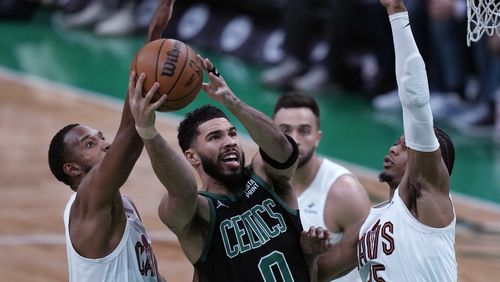 Boston Celtics forward Jayson Tatum (0) drives to the basket against the Cleveland Cavaliers during the first half of Game 5 of an NBA basketball second-round playoff series Wednesday, May 15, 2024, in Boston. (AP Photo/Charles Krupa)