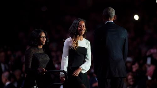 CHICAGO, IL - JANUARY 10: U.S. President Barack Obama greets daughter Malia and first lady Michelle Obama on stage after delivering his farewell address at McCormick Place on January 10, 2017 in Chicago, Illinois. (Photo by Darren Hauck/Getty Images)
