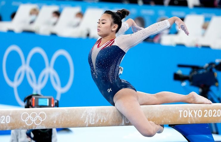 Sunisa Lee of the United States performs on the balance beam during the women's all-around gymnastics competition at the postponed 2020 Tokyo Olympics in Tokyo on Thursday, July 29, 2021. She won the all-around gold medal. (Chang W. Lee/The New York Times)