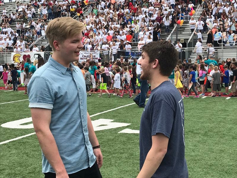  Harley Fuller meets his friend Caleb Lee Hutchinson after the rally. CREDIT: Rodney Ho/rho@ajc.com