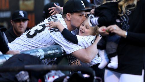 Chicago White Sox pitcher Danny Farquhar has some fun with his family before throwing out the ceremonial first pitch before a game against the Milwaukee Brewers at Guaranteed Rate Field in Chicago on June 1, 2018. Farquhar is recovering from a brain hemorrhage caused by a ruptured aneurysm that occurred in the White Sox dugout on April 20. (Chris Sweda/Chicago Tribune/TNS)
