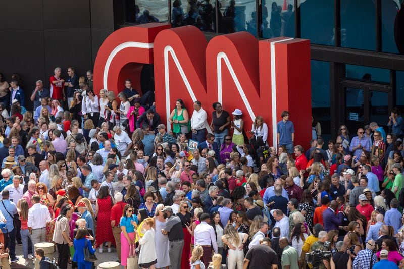 Hundreds of current and former CNN employees reunited outside CNN Center in Atlanta on Thursday, June 1, 2023. After more than 35 years, CNN is leaving its downtown building this year, with the entire operation moving to the Turner Techwood campus. (Arvin Temkar/The Atlanta Journal-Constitution/TNS)