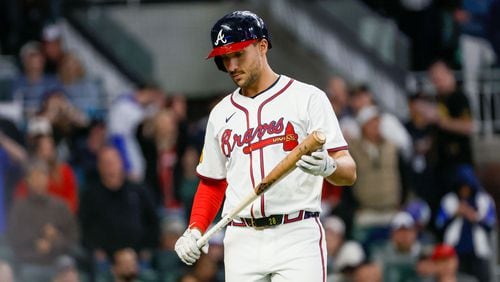 Braves first baseman Matt Olson (28) after striking out during the eighth inning against the Texas Rangers at Truist Park on Sunday, April 21, 2024. (Miguel Martinez/AJC)