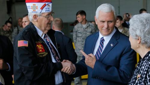 Vice President Mike Pence, right, spent a moment talking with WWII Navy veteran Alan Hall, from Canton, and his wife, Buena at Dobbins Air Reserve Base after speaking there in June 2017.   BOB ANDRES  /BANDRES@AJC.COM