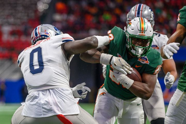 Florida A&M running back Terrell Jennings gets past Howard's Kenny Gallop Jr. for a touchdown in the Celebration Bowl at Mercedes Benz Stadium in Atlanta, Georgia on Dec. 16, 2023. (Jamie Spaar for the Atlanta Journal Constitution)
