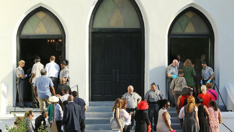 The doors reopen for church service at the “Mother” Emanuel A.M.E. Church four days after the mass shooting that claimed the lives of its pastor and eight others on Sunday, June 21, 2015, in Charleston. Curtis Compton / ccompton@ajc.com