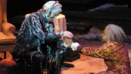 Chris Kayser as Jacob Marley with Kenny Leon as Scrooge in the Alliance Theatre’s 2002 production of “A Christmas Carol.” The Alliance recently announced that Kayser, who retired from the role of Scrooge after his 16th performance in the part in 2013, will return as Marley this November, playing opposite David de Vries as Scrooge. CONTRIBUTED BY ALLIANCE THEATRE