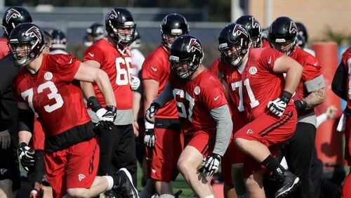 Falcons tackle Ryan Schraeder (73), guard Andy Levitre (67) and guard Wes Schweitzer (71) run through drills with teammates during a practice for the Super Bowl, Thursday, Feb. 2, 2017, in Houston. Atlanta will face the New England Patriots in the Super Bowl Sunday. (AP Photo/Eric Gay)