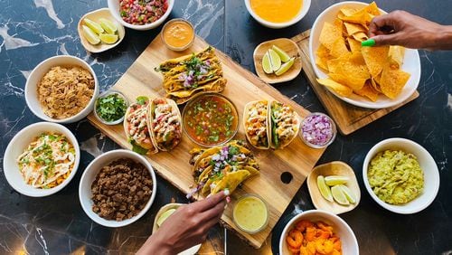 The Pretty Little Tacos menu includes a variety of tacos and sides like street corn and chips and salsa. /  Courtesy of Pretty Little Tacos