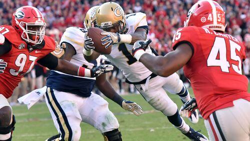 November 26, 2016 Athens - Georgia Tech running back Qua Searcy (1) leaps over for a game winning touchdown in the second half at Sanford Stadium on Saturday, November 26, 2016. Georgia Tech won 28-27 over the Georgia. HYOSUB SHIN / HSHIN@AJC.COM
