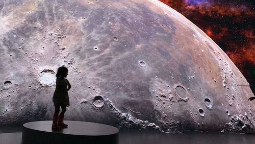 The latest Illuminarium immersive experience is focused on "Space" including the moon landing, trips to the outer edges of the solar system and the constellations. RODNEY HO/rho@ajc.com