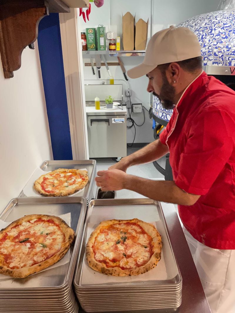 Vesuvio chef-owner Massimo Andreozzi makes pizza at his new restaurant.