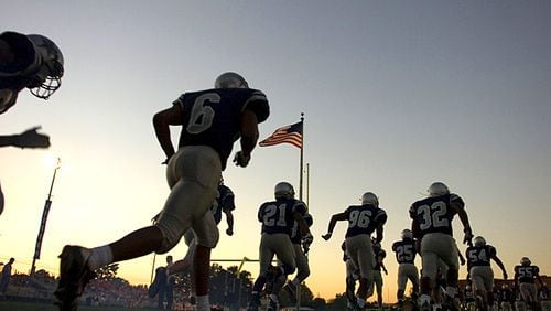 The South Gwinnett football team takes the field for a game against Parkview in Snellville.