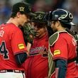 Atlanta Braves' Max Fried (54) speaks with bullpen coach Erick Abreu, center, and catcher Travis d'Arnaud (16) on the mound in the third inning of a baseball game against the San Diego Padres, Friday, May 17, 2024, in Atlanta. (AP Photo/Mike Stewart)