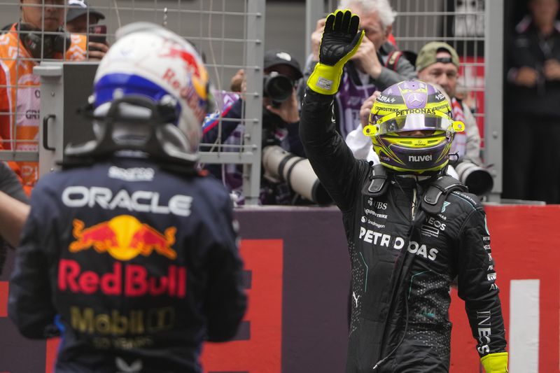 Mercedes driver Lewis Hamilton of Britain reacts after his second place finish in the sprint race at the Chinese Formula One Grand Prix at the Shanghai International Circuit, Shanghai, China, Saturday, April 20, 2024. (AP Photo/Andy Wong)
