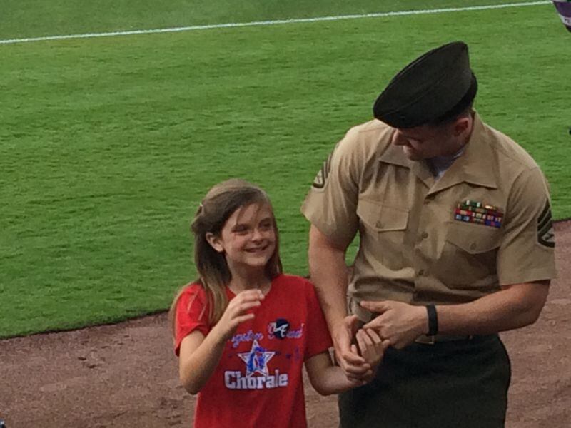 USMC Staff Sgt. Clayton Walker and his delighted daughter Cassidy. Photo: Jennifer Brett
