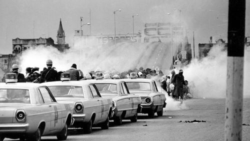 March 7, 1965: clouds of tear gas fill the air as state troopers, ordered by Gov. George Wallace, break up a demonstration march in Selma, Ala., on what became known as "Bloody Sunday." The Journal and Constitution chose not to send staff reporters to cover some of the biggest stories of the civil rights movement, including this one.  (AP Photo/File)