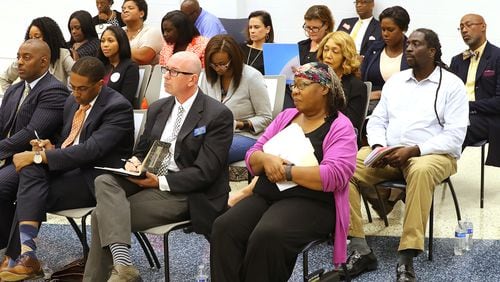 Two dozen candidates for the Atlanta Board of Education gather to participate in an election forum at the IBEW Auditorium on Tuesday.    Curtis Compton/ccompton@ajc.com